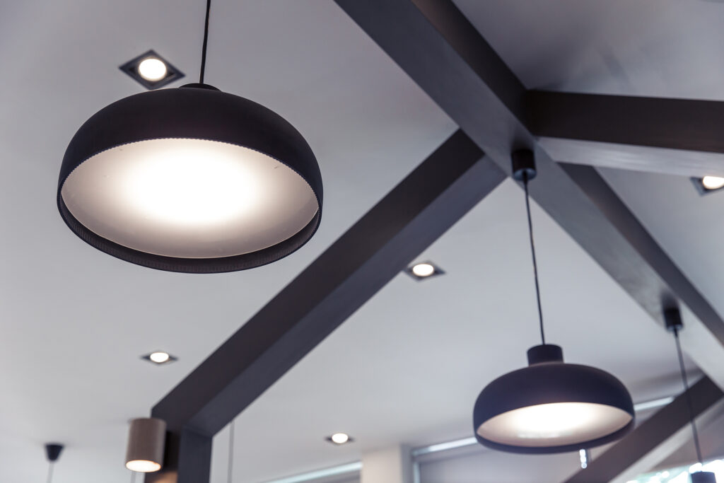 Drop lights hanging from ceiling of modern-style home